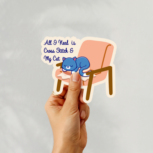 Handheld sticker of “All I Need is Cross Stitch & My Cat” design
