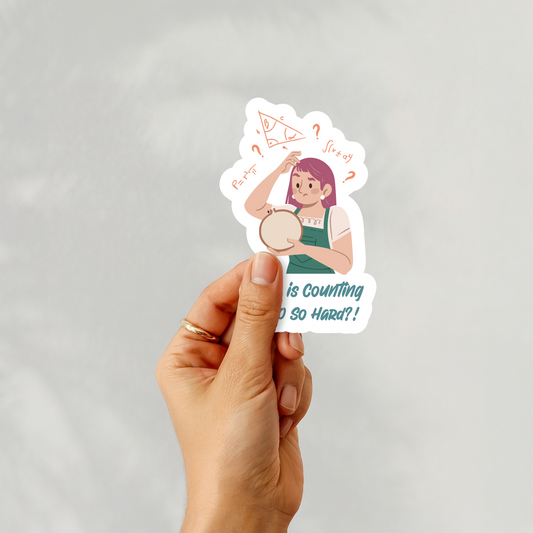 Hand holding “Why is Counting to 10 So Hard?” sticker with confused stitcher and math symbols