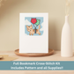 Cross-stitch greeting card featuring a tan cat floating with colorful balloons against a blue sky.
