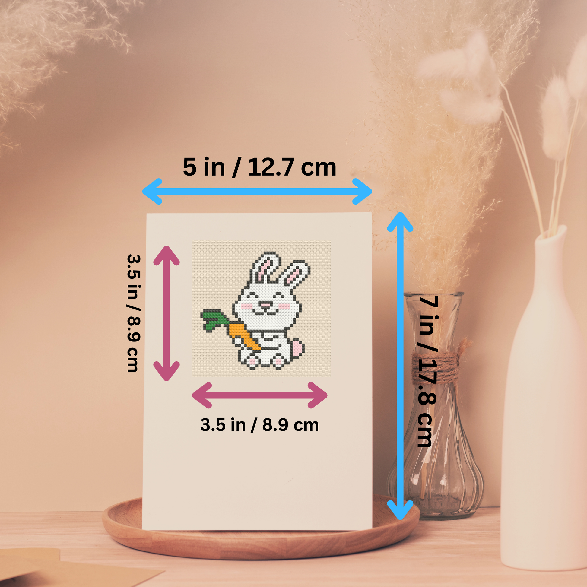 Size dimensions of the cross-stitch greeting card kit, showing both the card and stitched design measurements.