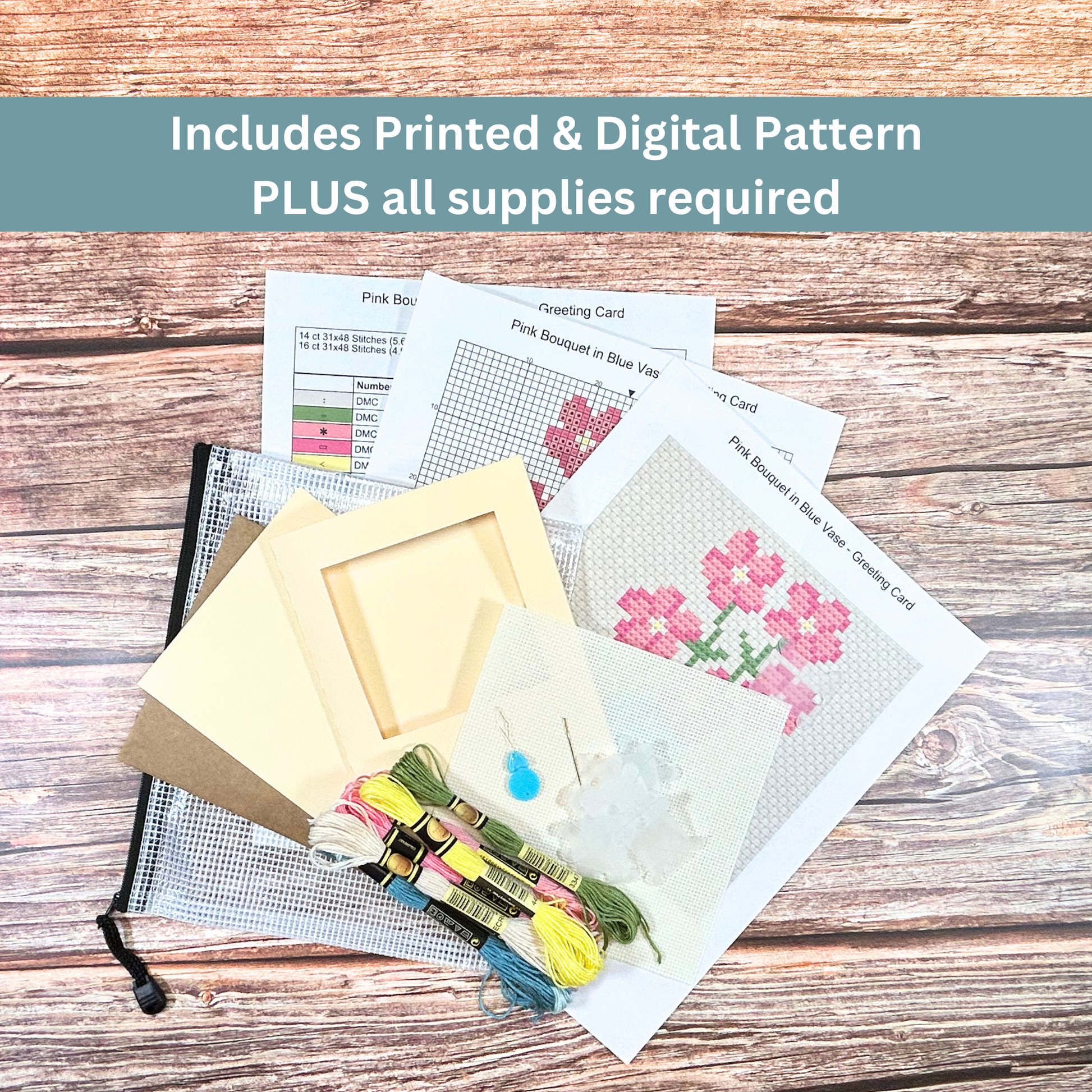 Complete cross-stitch kit featuring a pink bouquet in a blue vase, including Aida cloth, embroidery floss, and pattern sheets.