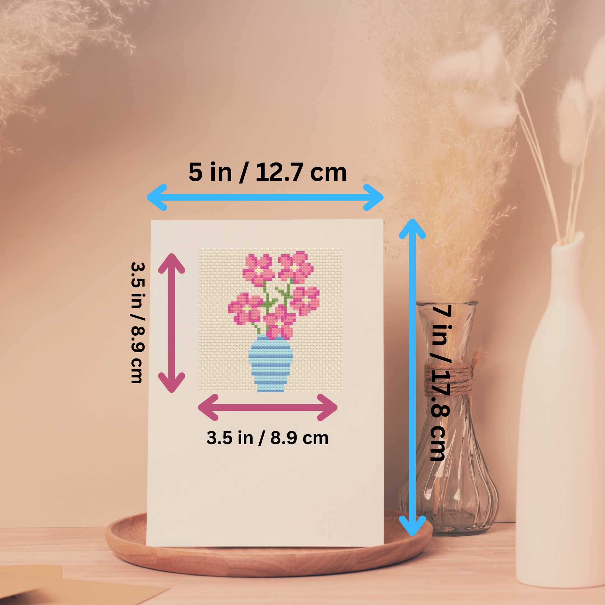 Size dimensions of the cross-stitch greeting card kit, showing both the card and stitched design measurements.