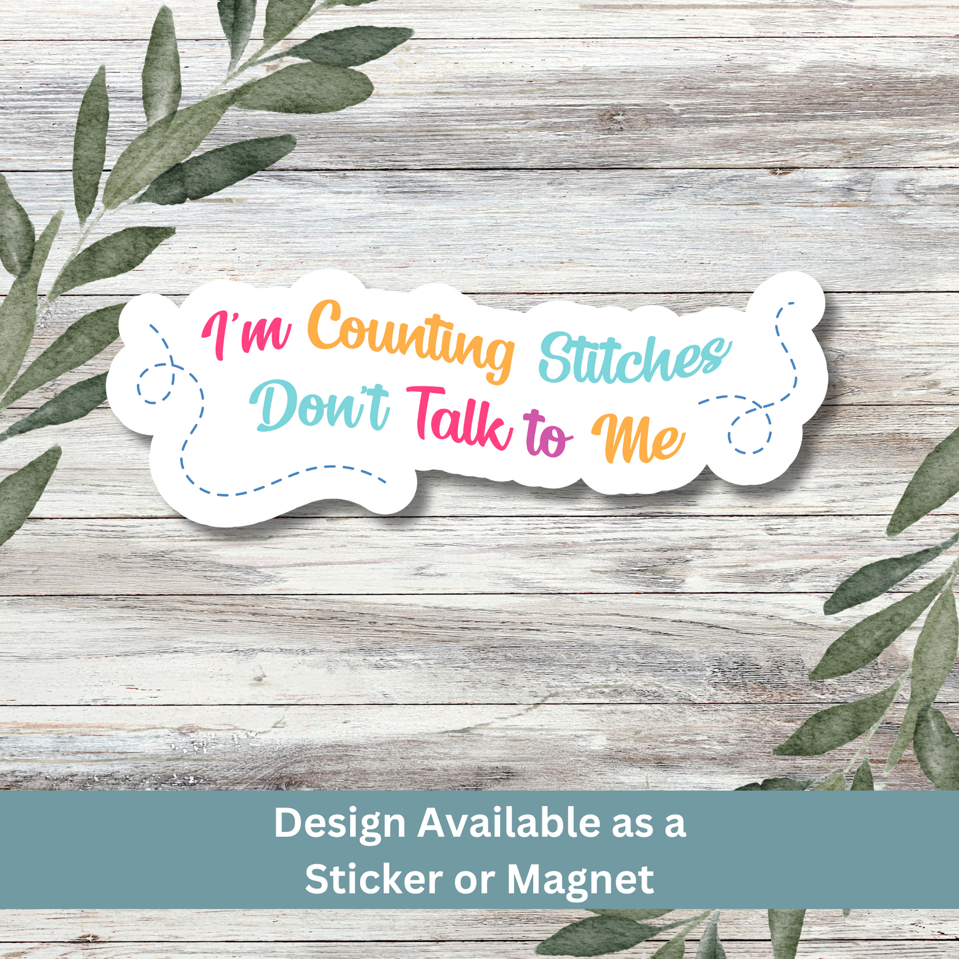 Sticker of “I’m Counting Stitches Don’t Talk to Me” on a whitewashed wood background