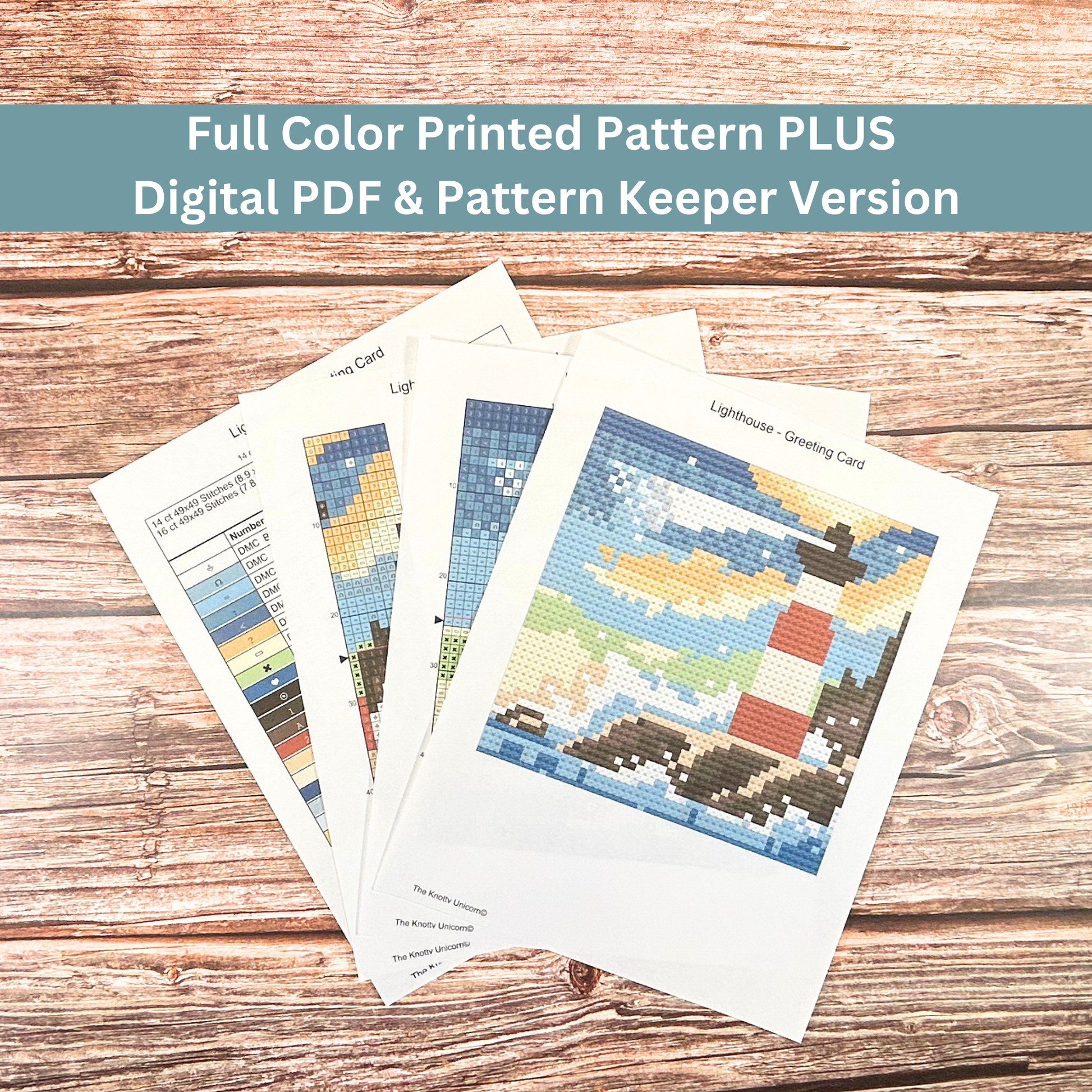 Full-color printed cross-stitch pattern of a lighthouse with ocean waves and a sunset sky.