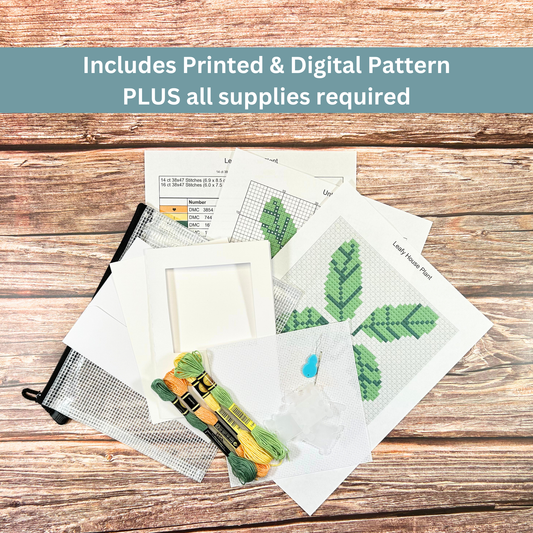 Complete cross-stitch kit including Aida cloth, embroidery floss, pattern sheets, and greeting card materials.