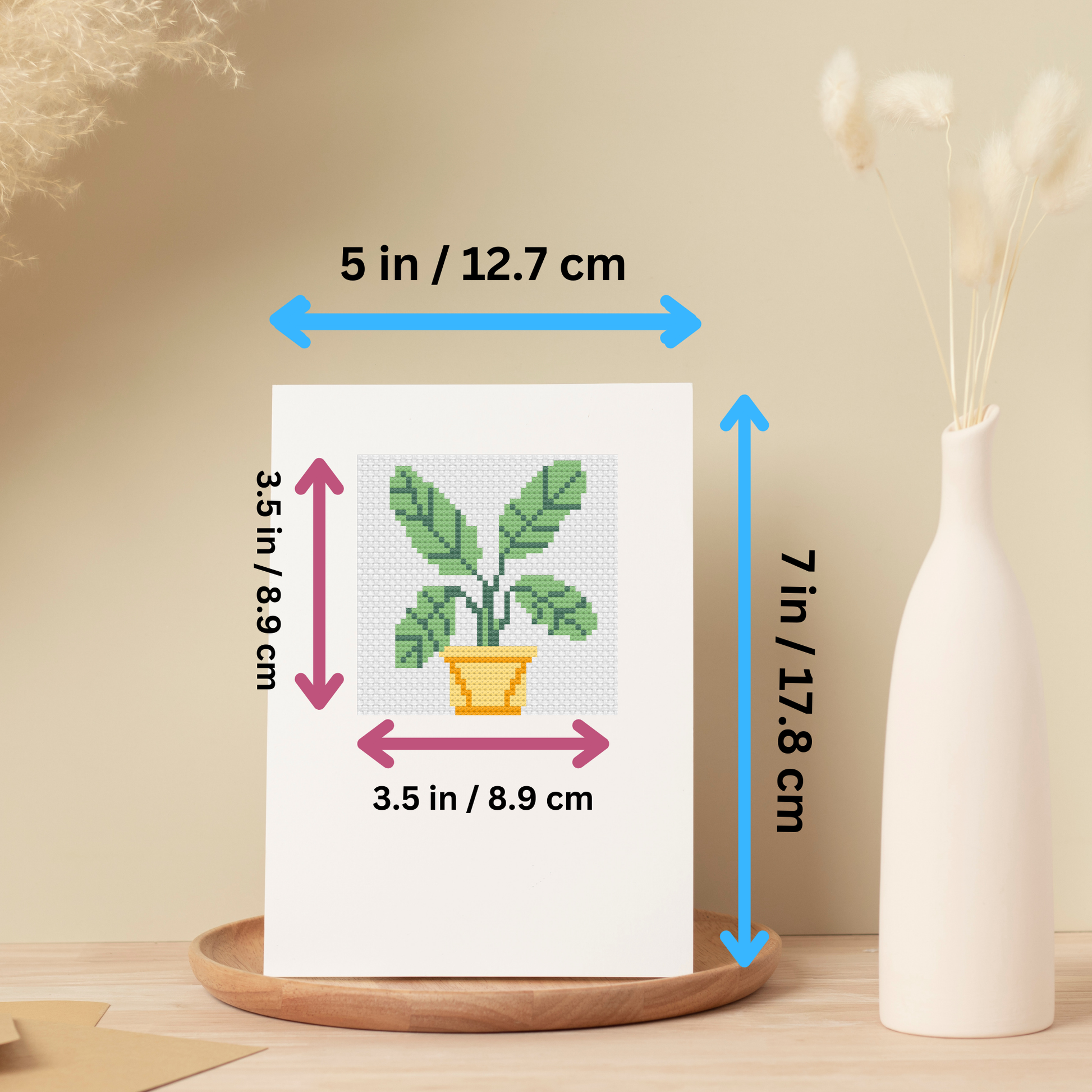 Printed cross-stitch pattern sheets for a leafy houseplant design, including a color key and stitch guide.