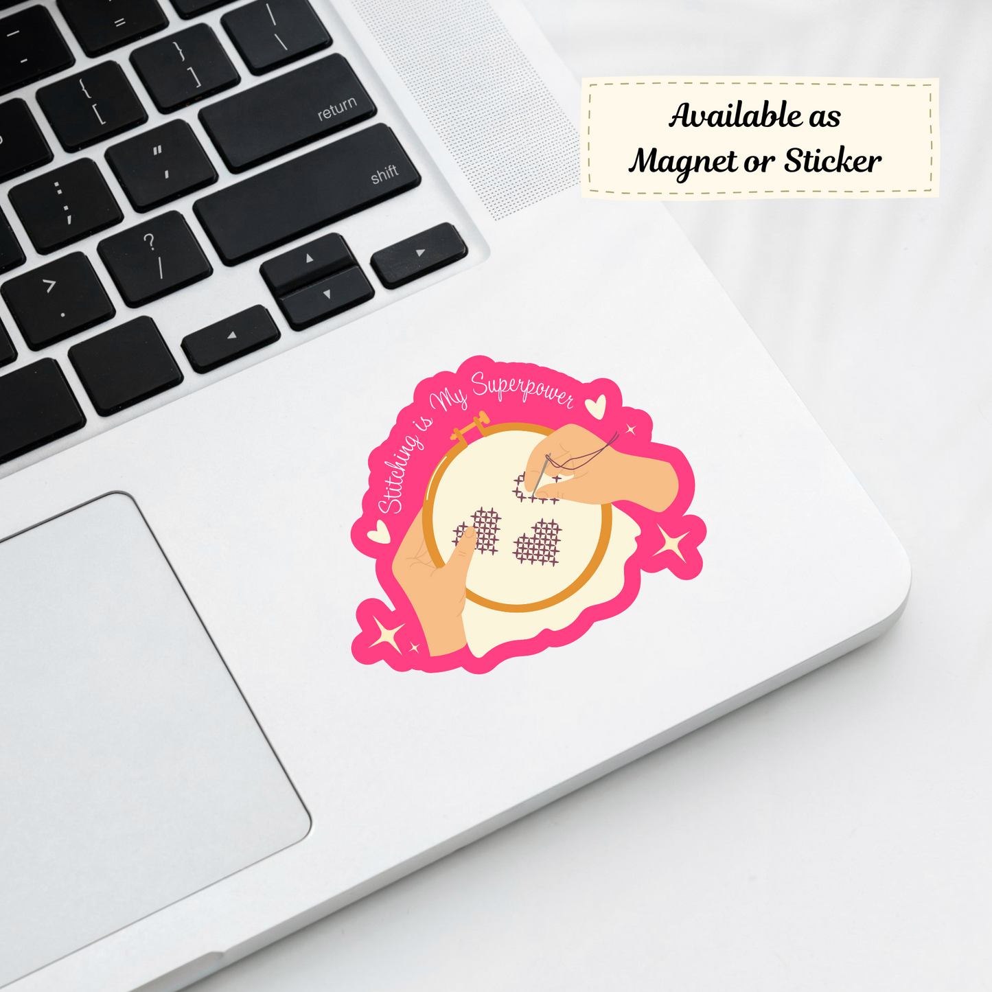 Empowering stitching sticker on a laptop by embroidery threads.